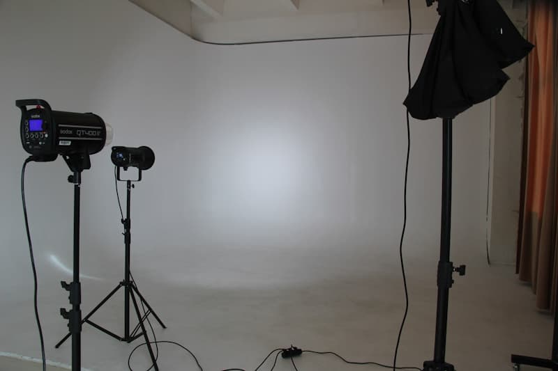 Professional photography studio with lighting equipment and backdrop