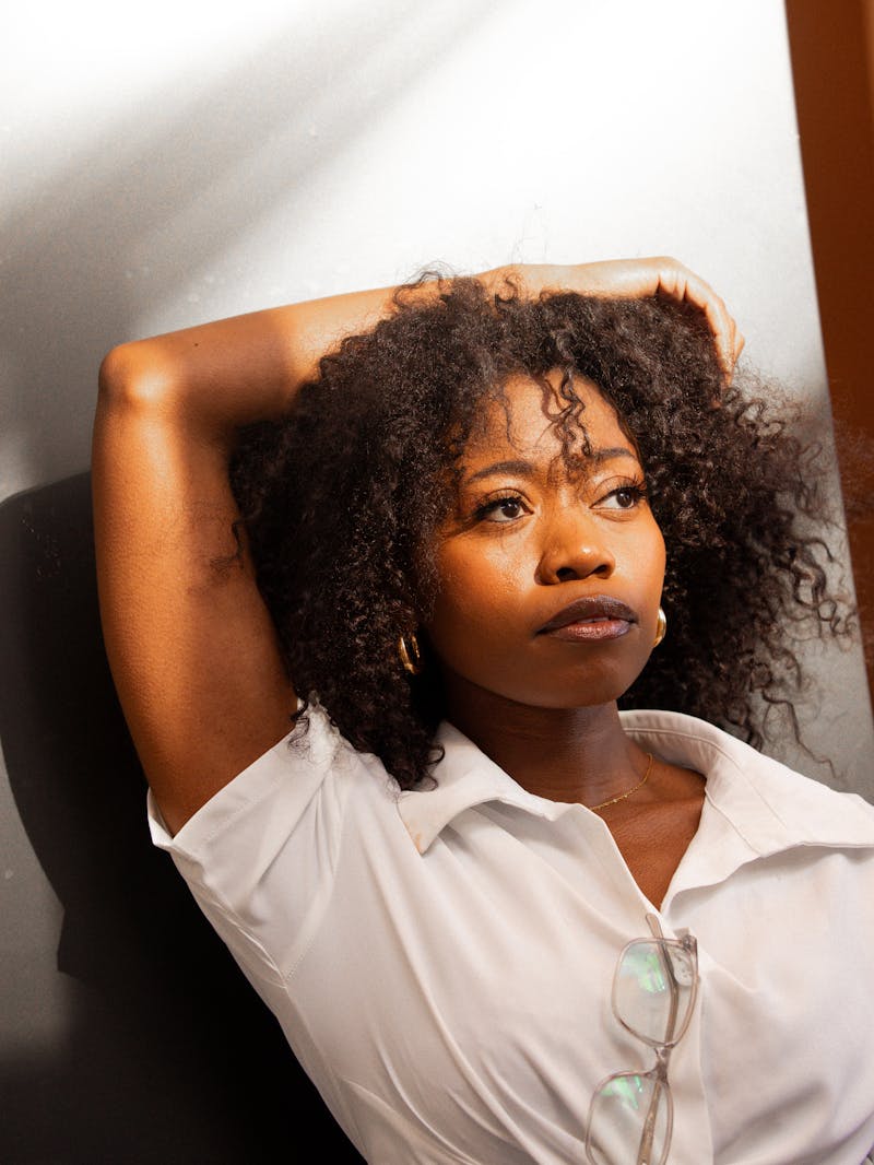 Creative personal branding portrait with natural lighting and artistic composition