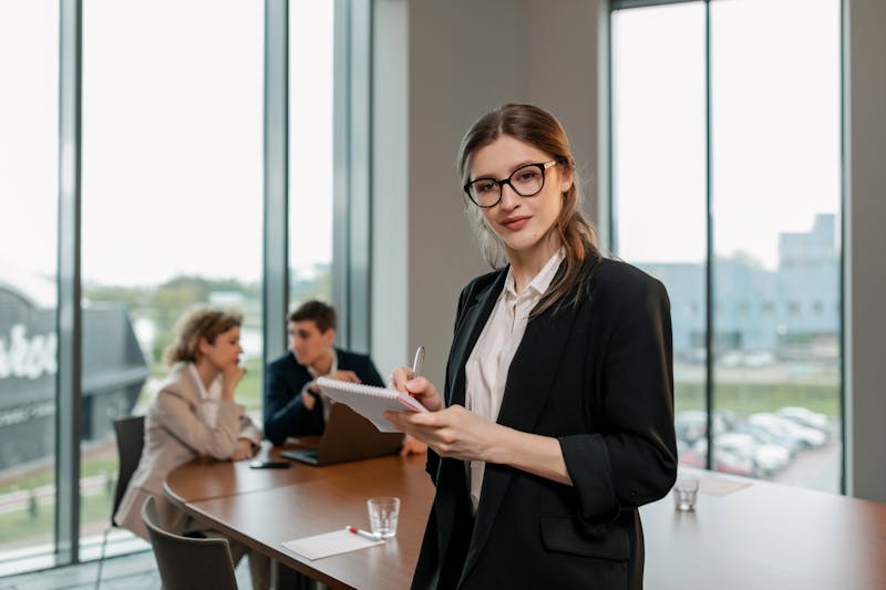 Woman in a black blazer, a classic headshot wardrobe choice